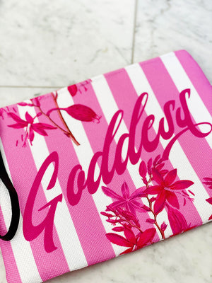 Pink florals and stripes adorn this luxe zipper pouch